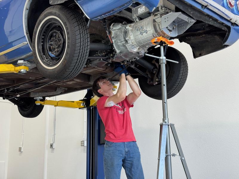Working underneath a 1965 Chevrolet Corvair